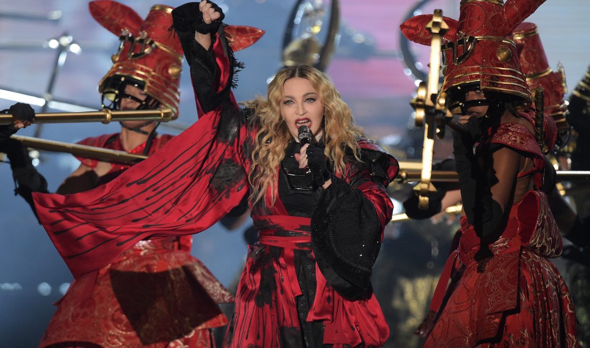 The US American pop singer Madonna performs on stage at the Mercedes Benz Arena in Berlin, Germany, 10 November 2015. Photo: RAINER JENSEN/dpa