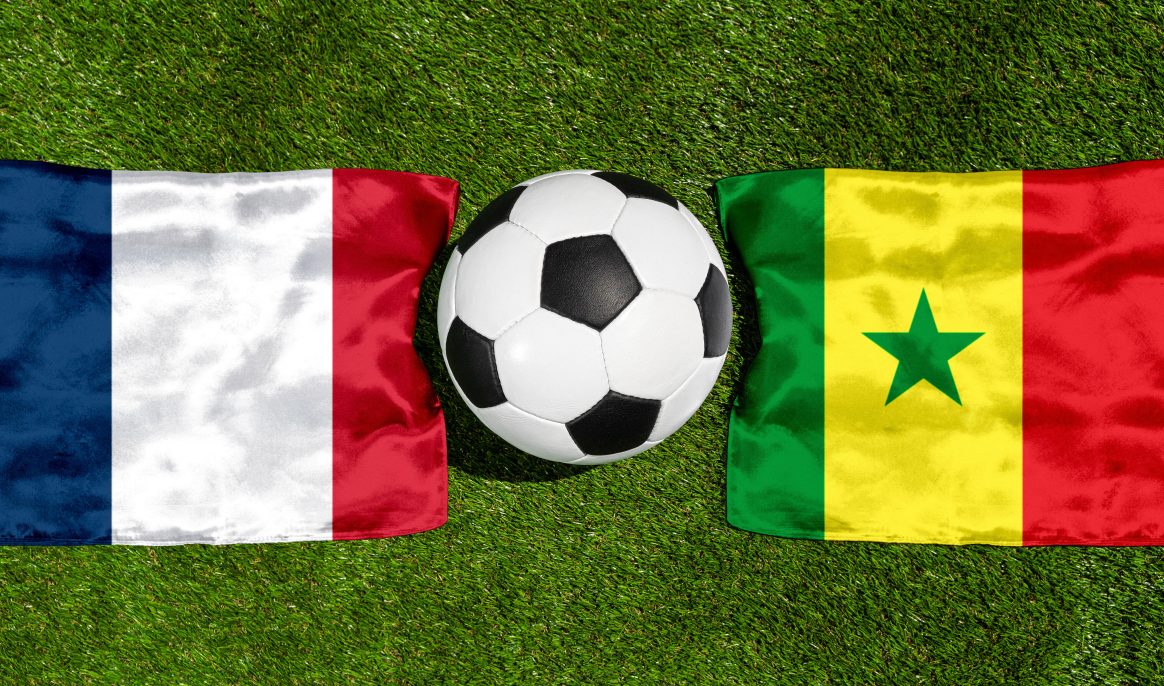 PHOTOMONTAGE, FIFA Football World Cup 2026: National Flags Of Frankreich And Senegal With A Football On Grass. Symbol Image For The World Cup Group Match On 16 June At The FIFA Football World Cup 2026