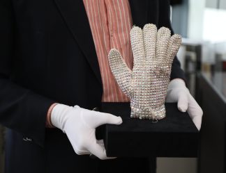 NEUILLY-SUR-SEINE, FRANCE - APRIL 28: Michael Jackson's right hand glow, he worn at 'Bad' tour, is displayed during a press preview of the exhibition 'Pop Culture & Memorabilia: Michael' at Aguttes auction house in Neuilly-sur-Seine, near Paris, France, on April 28, 2026. The collection, featuring around 50 items including iconic stage costumes and personal objects, will be exhibited from May 30 to June 2, followed by a public auction on June 3, with estimated prices ranging from 400 euros to over 100,000 euros. Mohamad Salaheldin Abdelg Alsayed / Anadolu