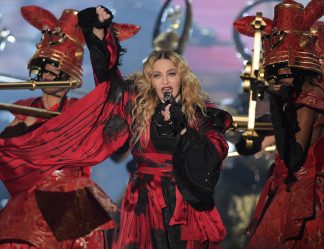 The US American pop singer Madonna performs on stage at the Mercedes Benz Arena in Berlin, Germany, 10 November 2015. Photo: RAINER JENSEN/dpa