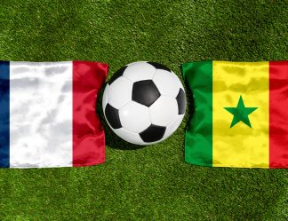 PHOTOMONTAGE, FIFA Football World Cup 2026: National Flags Of Frankreich And Senegal With A Football On Grass. Symbol Image For The World Cup Group Match On 16 June At The FIFA Football World Cup 2026